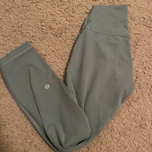Lululemon Wunder train high rise leggings in a dark mint green